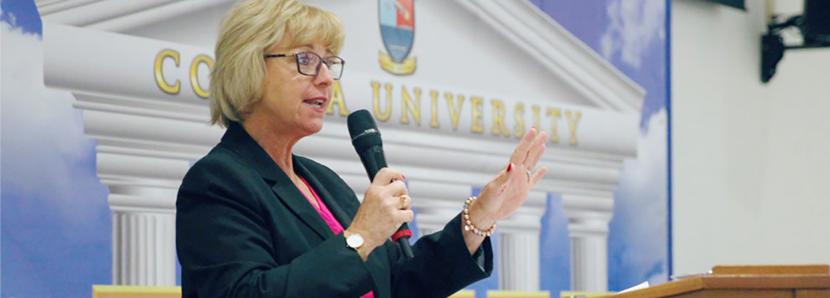 NSWC Corona Technical Director, Dianne Costlow speaks at a corona university event.